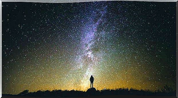 man facing the starry sky