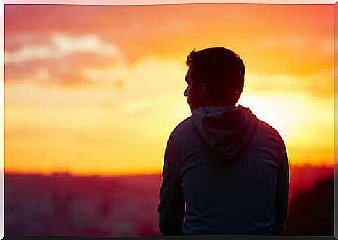 A young man looks thoughtful. 