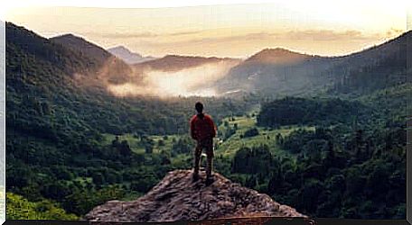 A man on top of a mountain.